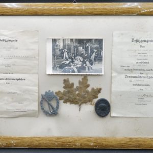 German Veteran framework with pictures, citations and badges